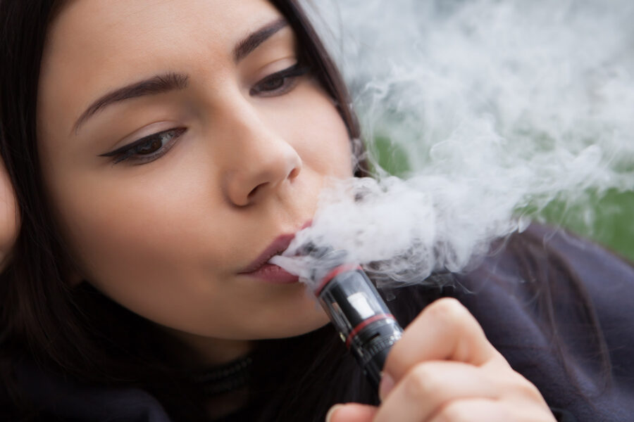 Young woman vaping