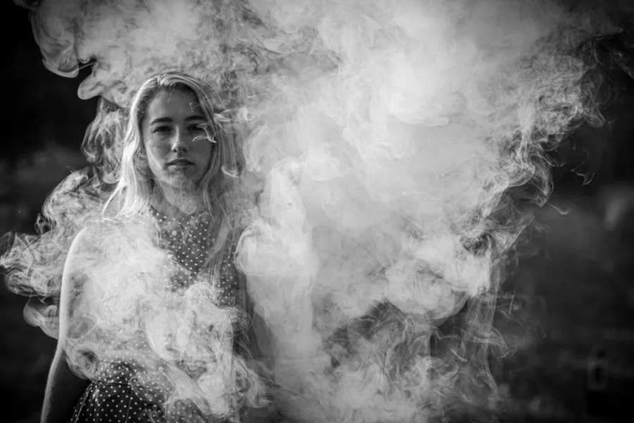 girl standing in smoke