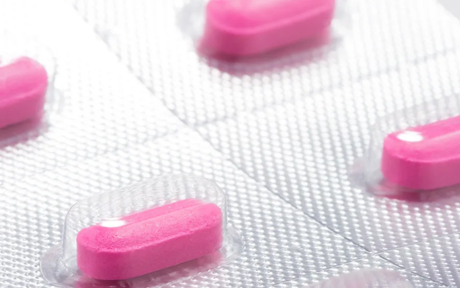 Pink antihistamine allergy tablets in blister pack close up